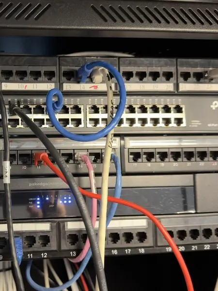 Patch panels and a 48 port switch part way through the job, with only a handful of leads connected so far