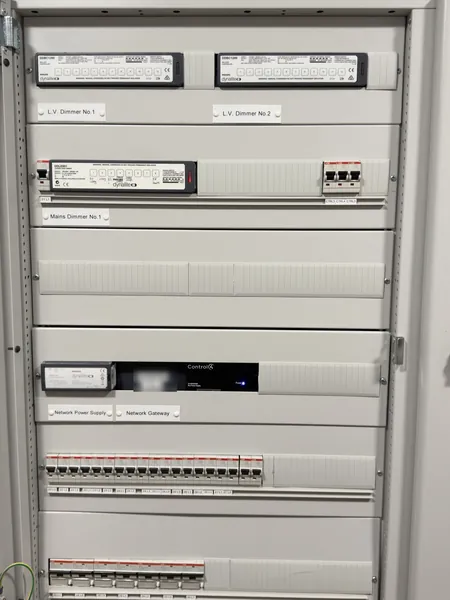 Dimmer cabinet: a mains dimmer and two low voltage dimmers on top, then the gateway and its power supply, then circuit breakers