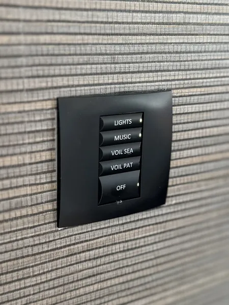 Five buttons on one keypad give lights, music, two separate sets of voiles and an off button