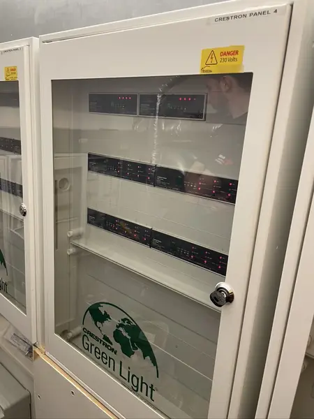Behind a locked glass door, the Green Light lighting panels and their dimmer modules that stayed in the upgrade