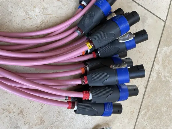 Speaker cables ending in numbered speakON plugs, each one ready for its amplifier output