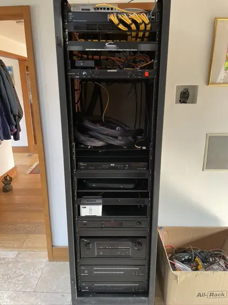 Rack front mid upgrade: the network switch at the top and the pair of six room audio systems at the bottom