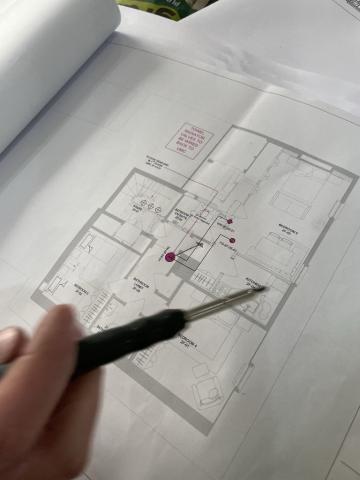 A floor plan drawing marked up with device positions and wiring notes for a smart home