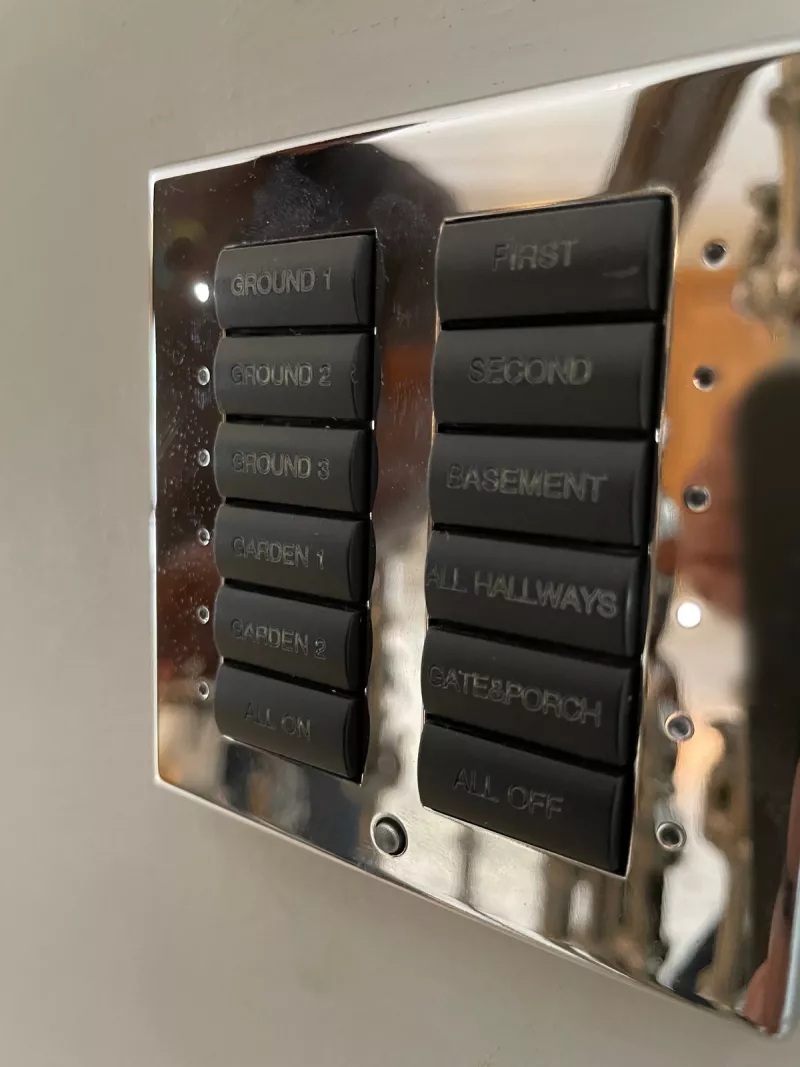 Chrome keypad with black buttons engraved Ground, Garden, First, Second, Basement, All Hallways, Gate and Porch, All On and All Off
