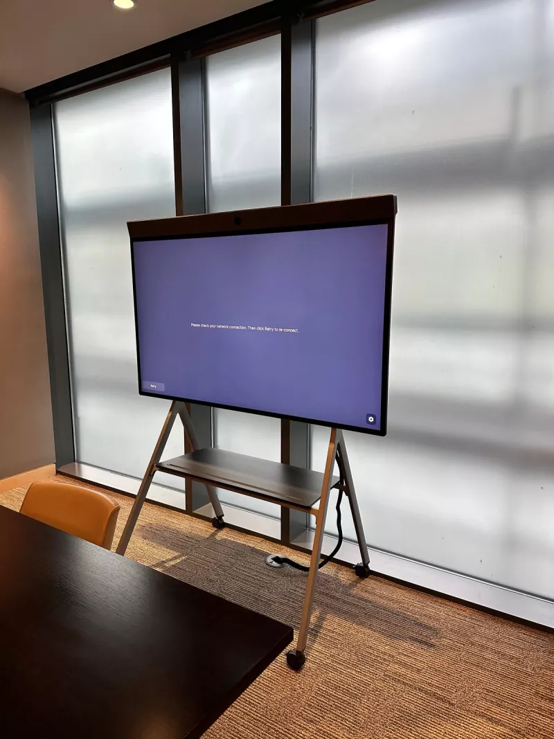 Neat Board on its stand switched on for the first time, showing a prompt to check the network connection