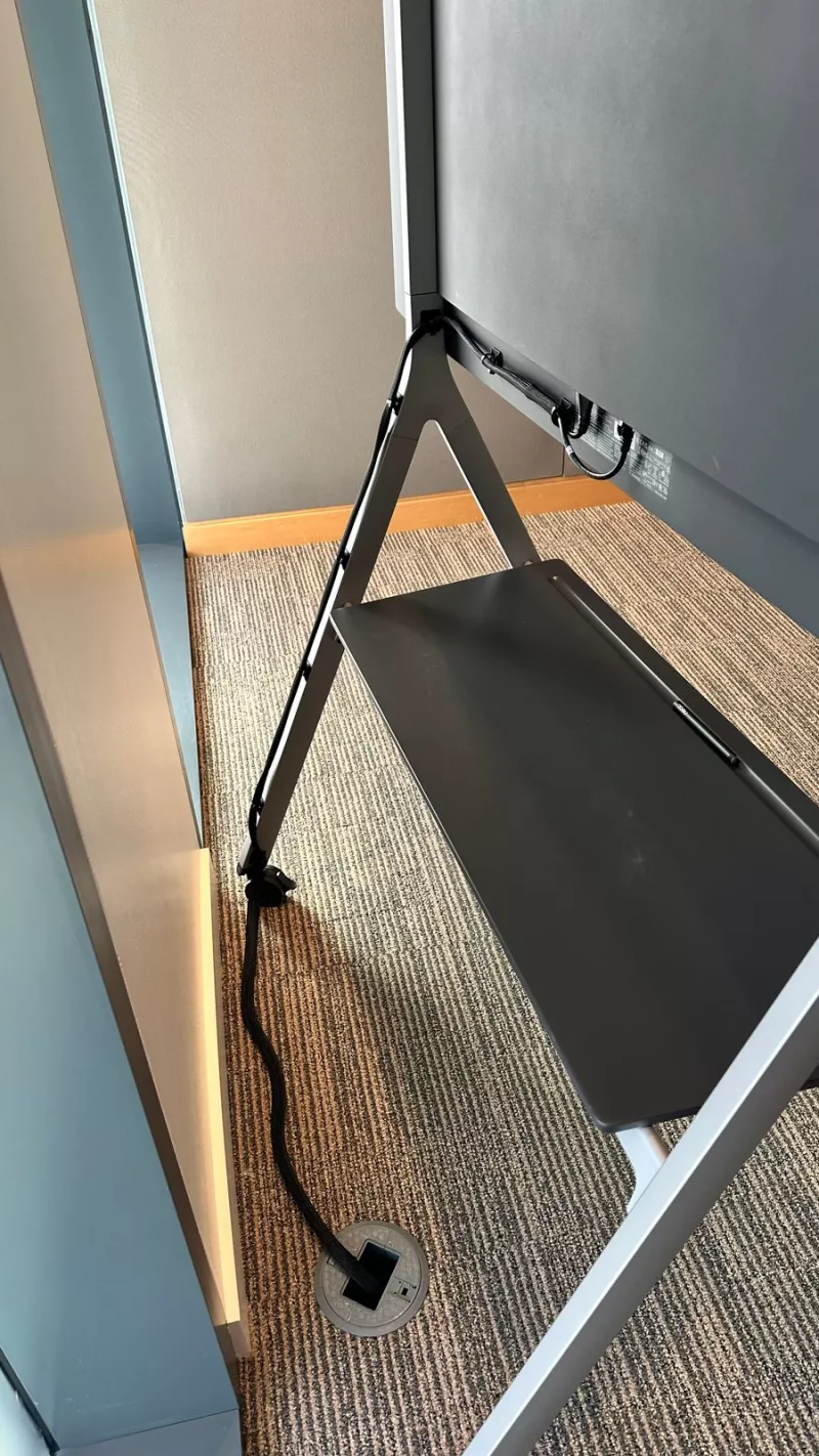 Rear of the Neat Board stand, where the cable runs down to a floor box