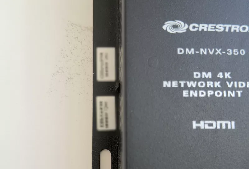 Close view of the label on a Crestron DM-NVX-350 4K network video endpoint