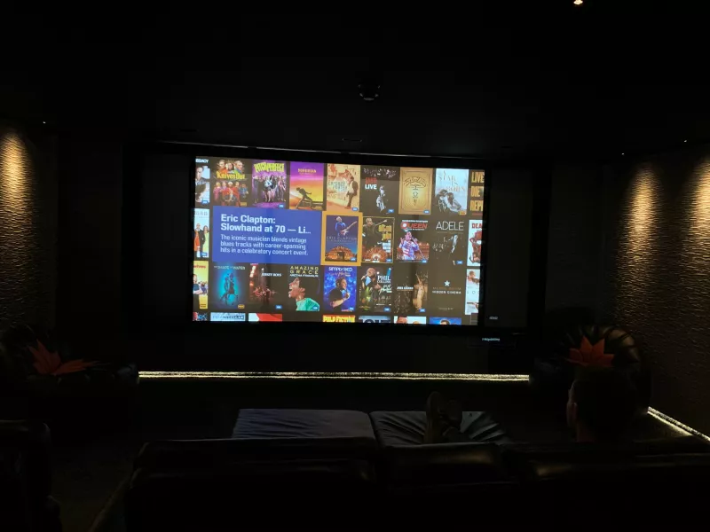 The projector screen lit up in the Finchampstead cinema, with the room in darkness