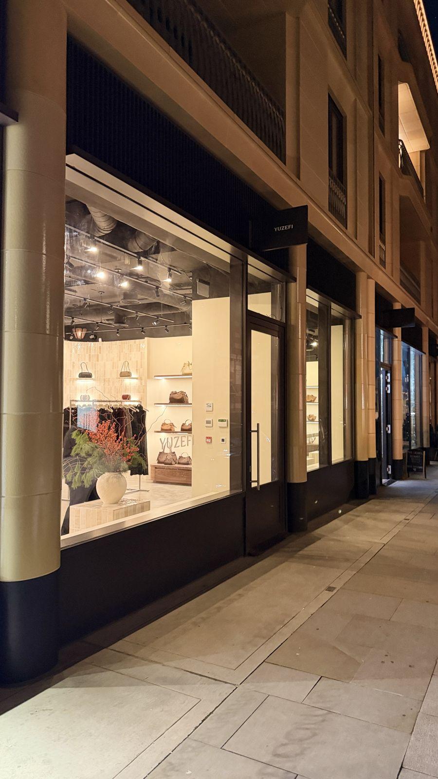 Yuzefi flagship store in Marylebone at night, lit by Crestron lighting control