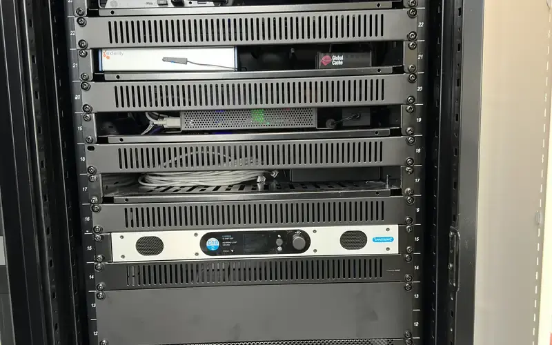 Neatly racked AV equipment including a power amplifier