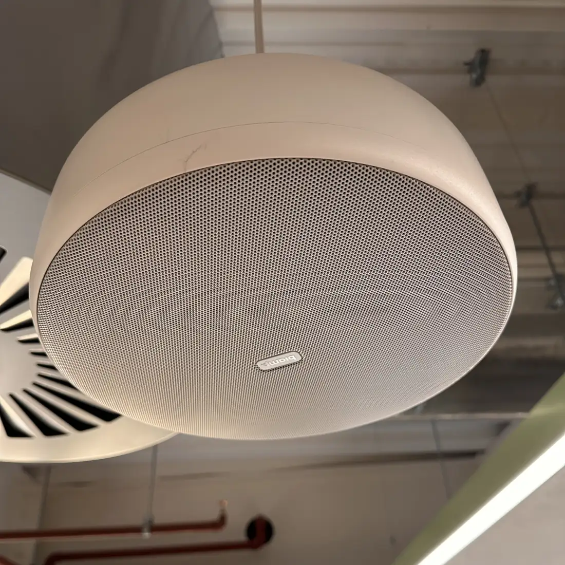 Ceiling microphone and speaker in a meeting room