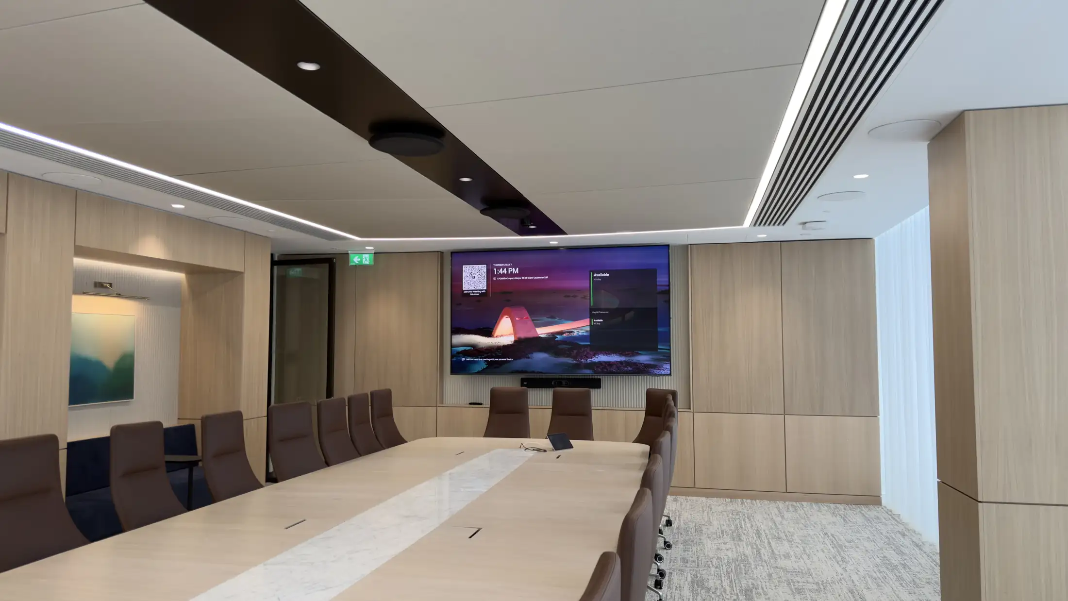 Boardroom with a Microsoft Teams Rooms display installed by 1Install